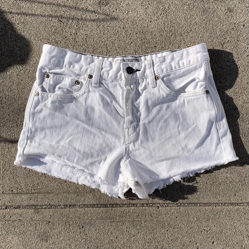 Free people white denim shorts in a size 26